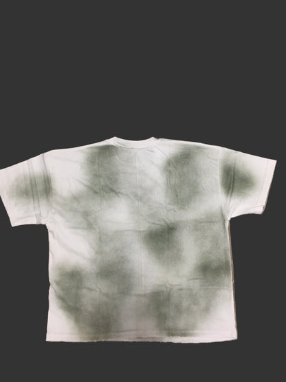 White garment with greenish-brown abstract pattern
