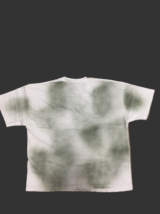 White garment with greenish-brown abstract pattern