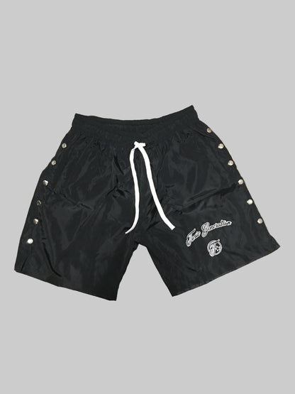 Black shorts with white drawstring and branding